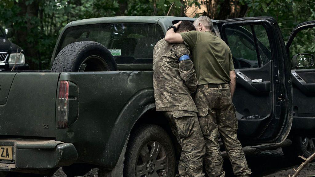 A soldier cries after returning from Kursk