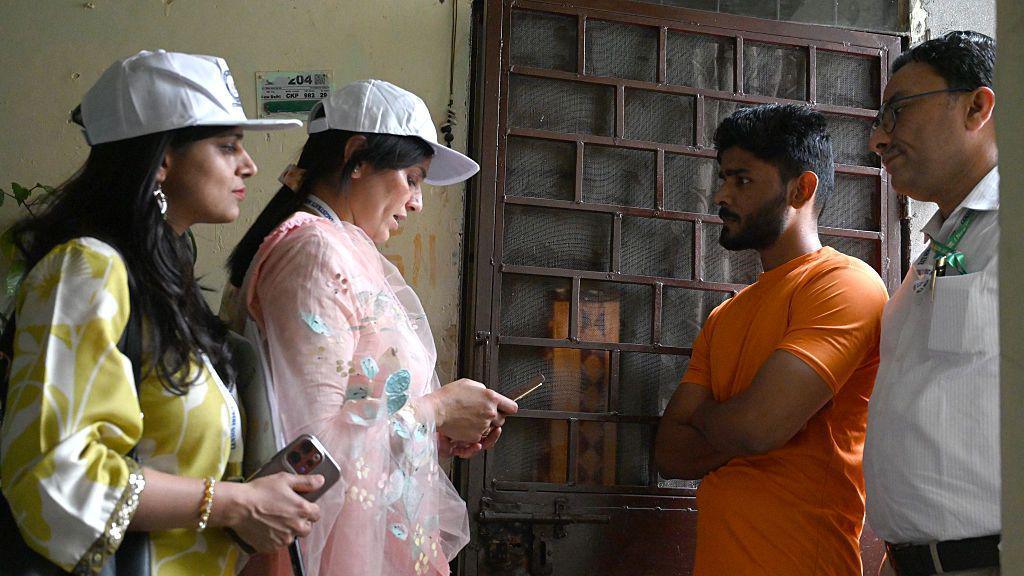 Enumerators travel door to door to do the census 