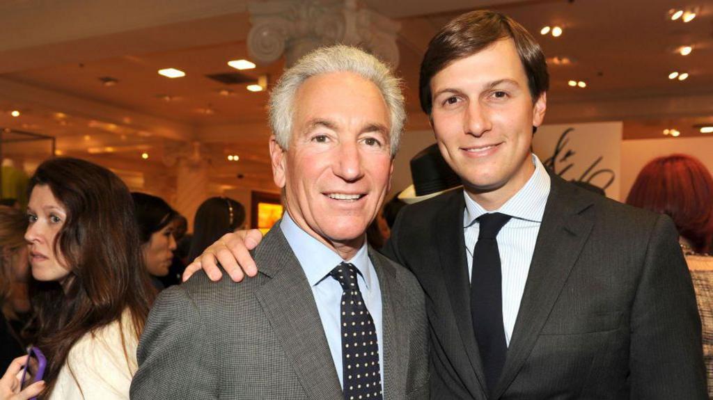 Charles Kushner (left) with his son Jared Kushner (right) dressed in suits