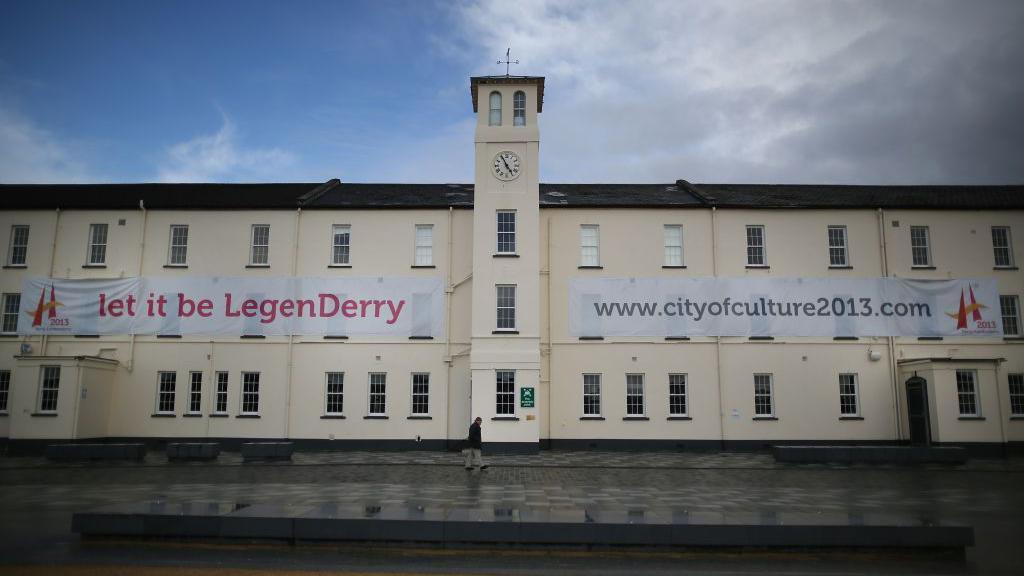 Building in Ebrington Square, Derry/Londonderry shown with the poster 'let it be LedenDerry' advertising UK City of Culture for 2013.