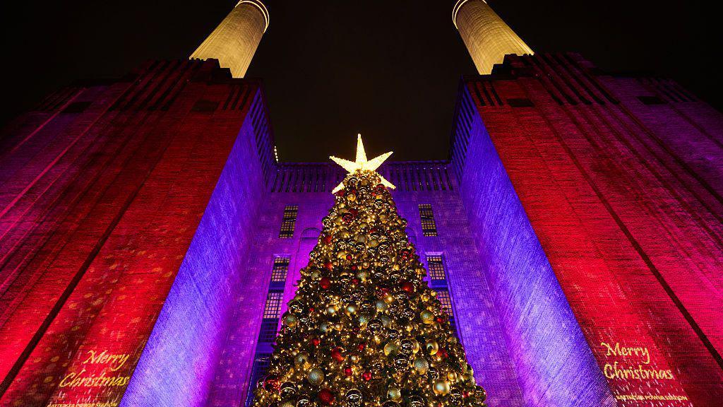 View looking up to a large Christmas tree at Battersea Power Station