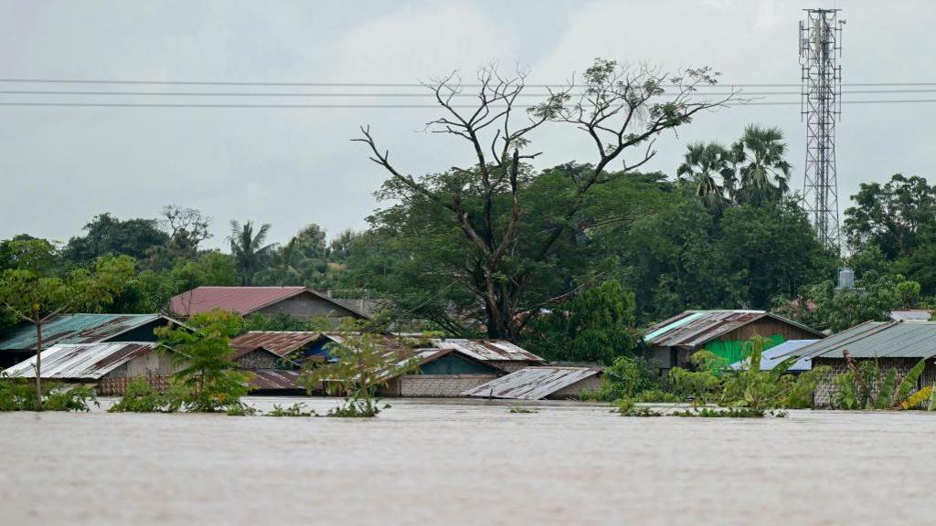 High flood water surrounds homes in Taungoo, Myanmar's Bago region on September 14, 2024