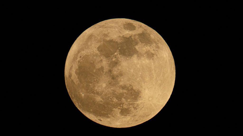 Moon rises in Caracas, Venezuela 