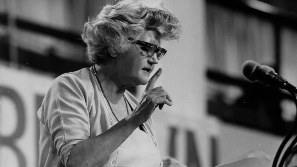 Black and white photo of arts minister and Labour politician Jennie Lee, speaking at a Labour Party Conference in Brighton.