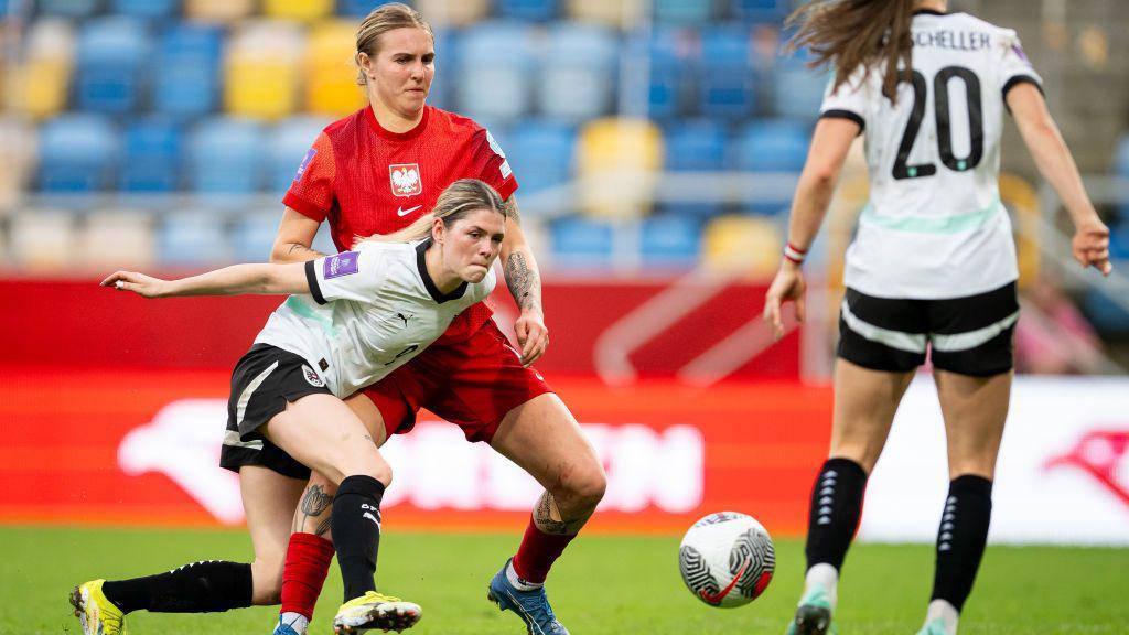 Eileen Campbell of Austria battle for the ball with Oliwia Wos of Poland during the UEFA Euro 2025 Women's Qualifiers match between Poland and Austria.