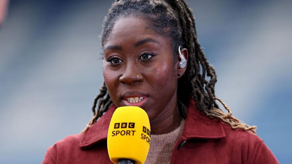 Anita Asante with a BBC Sport microphone