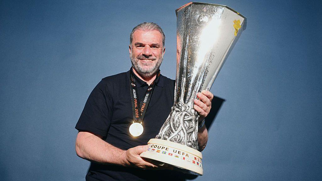 Ange Postecoglou with Europa League trophy