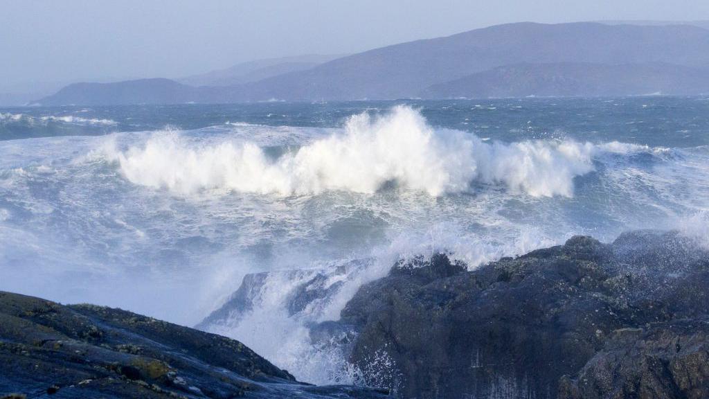 Waves crash onto the shore in Bantry Bay, Ireland.