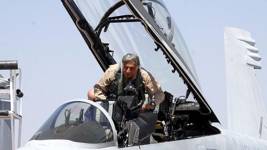 Tata Group Chairman Ratan Tata boarding a Boeing fighter F/A-18 Super Hornet at the Aero India 2011 at the Yelahanka air base on the outskirts of Bangalore on Thursday.