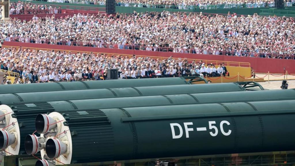 Spectators watch as DF-5C intercontinental strategic nuclear missiles are showcased at a military parade to mark the 80th anniversary of the end of World War Two, in Beijing, China September 3, 2025