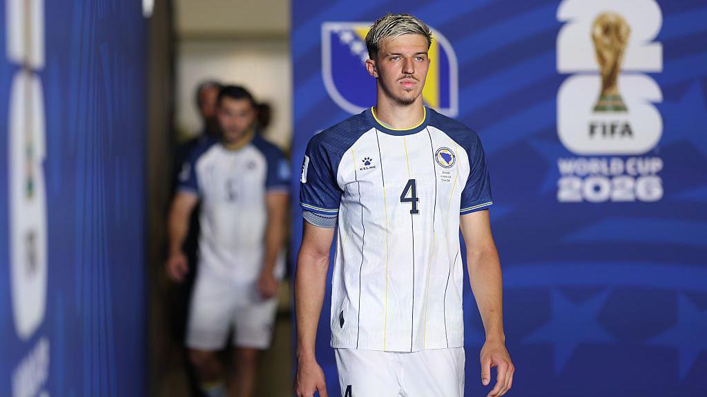 Tarik Muharemovic of Bosnia and Herzegovina walks out of the tunnel