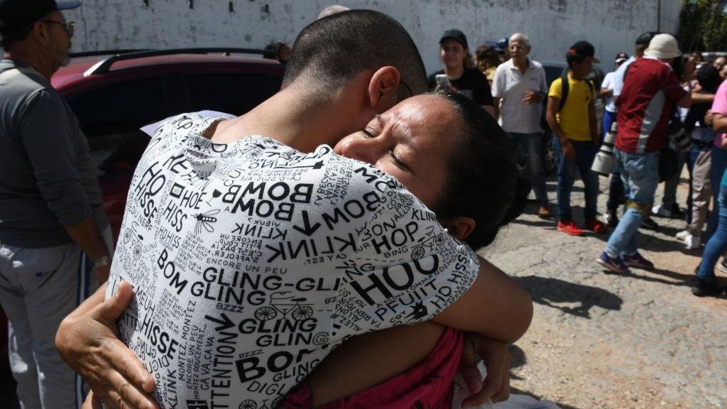 A man and a woman hug