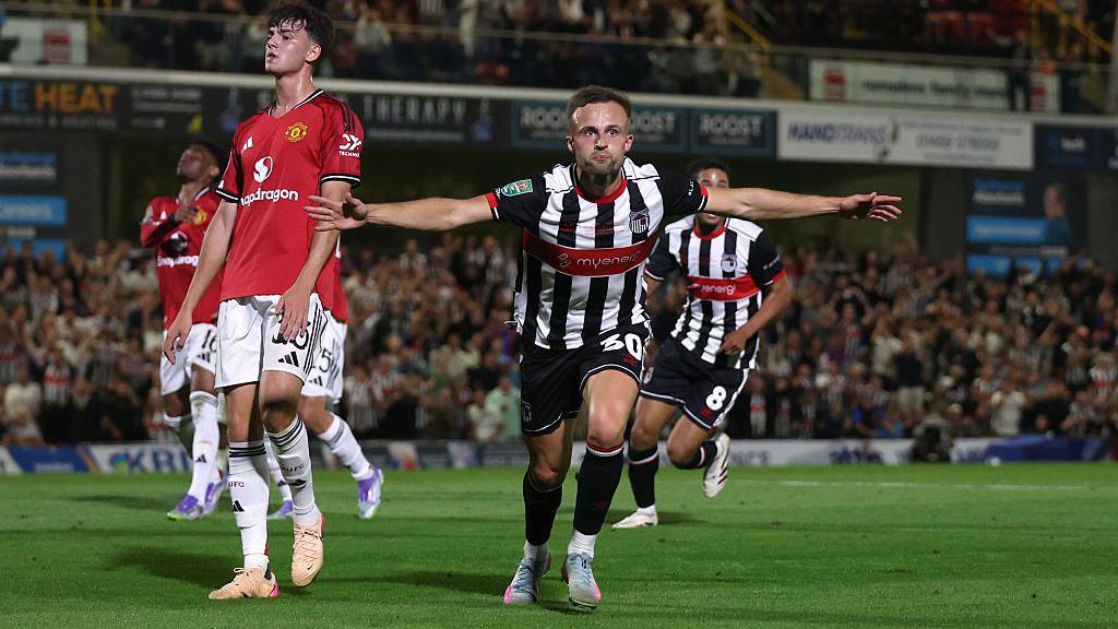 Charles Vernam celebrates scoring against Manchester United
