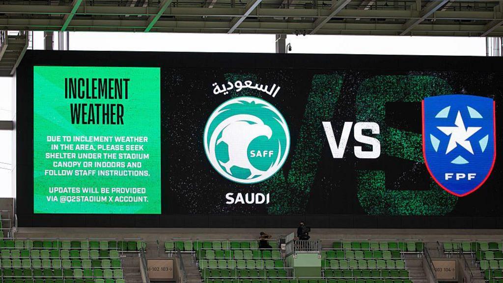 Large screen in the stadium explaining what to do in inclement weather