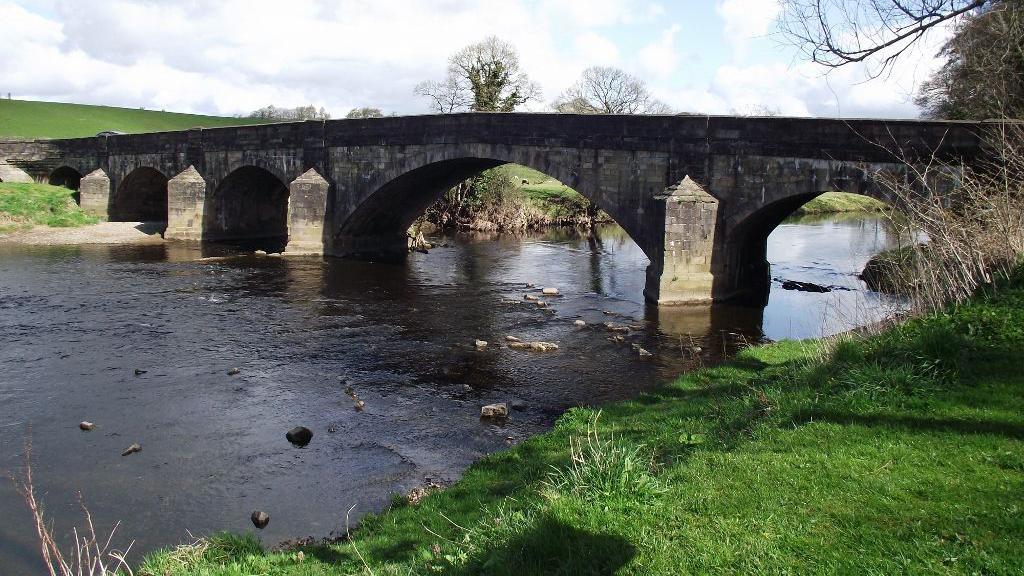 The Grade II listed Edisford Bridge spanning over the River Ribble near Clitheroe in Lancashire