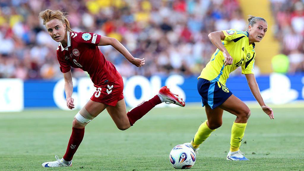 Karen Holmgaard of Denmark and Filippa Angeldal of Sweden look at a loose ball