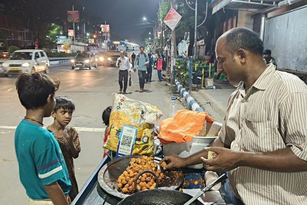Digital payment firm Paytm's QR codes are displayed at a street food vendor in Kolkata, India, on September 13, 2025. 