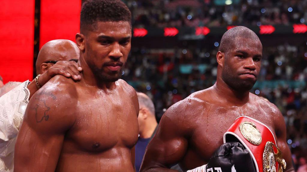 Anthony Joshua looks devastated with Daniel Dubois beside him