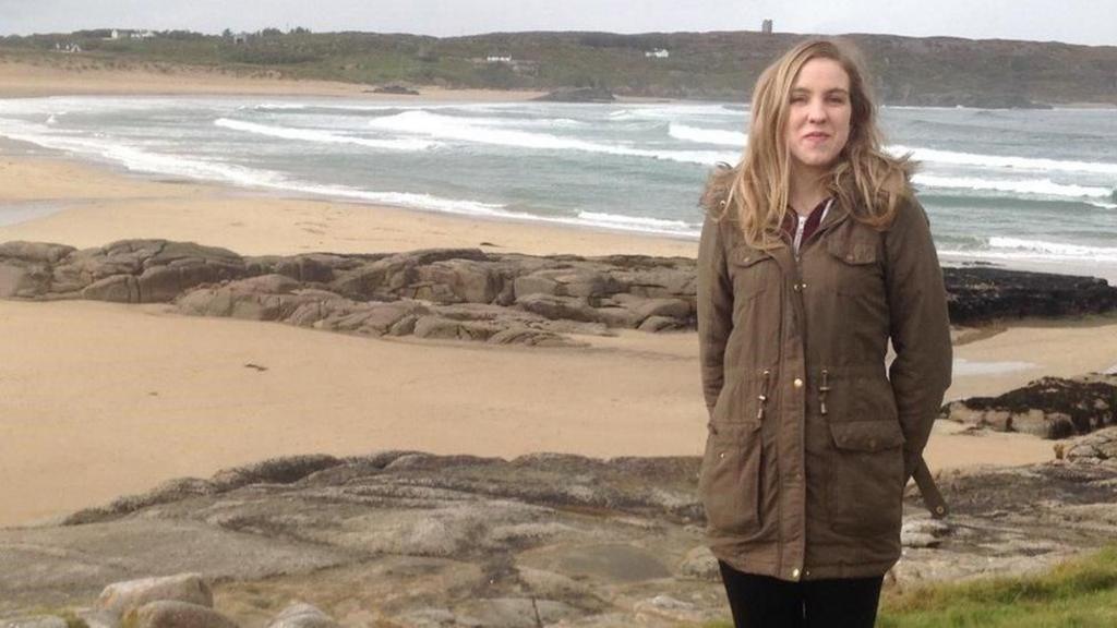 Natalie McNally standing on a beach