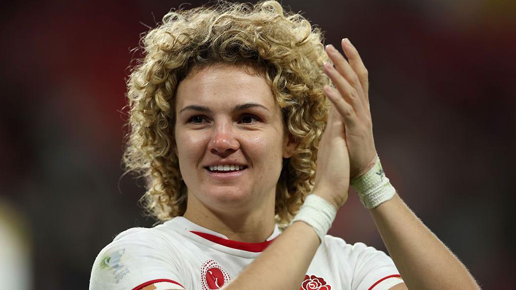 Ellie Kildunne celebrating wearing a rugby kit