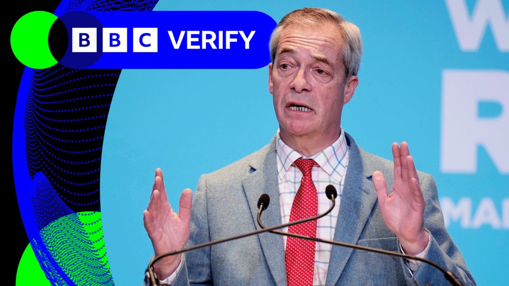 Nigel Farage speaking at a podium during a political rally, with a British flag visible in the background.