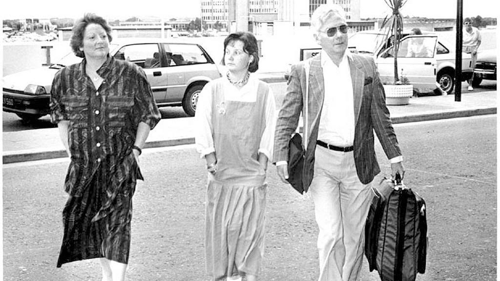 From left, musician Kathleen Watkins, her daughter Susie, and husband broadcaster Gay Byrne arrive at Dublin Airport, Dublin, Ireland, August 30, 1987. Byrne was leaving on a flight to Australia. (Part of the Independent Newspapers Ireland/NLI Collection) (Photo by Independent News and Media/Getty Images)