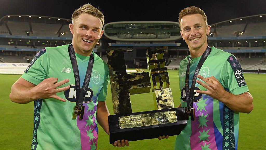 Sam Curran and Tom Curran holding The Hundred