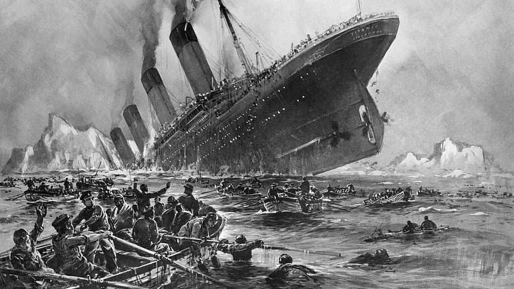 A black and white watercolour style painting of the Titanic sinking. There are icebergs visible on the horizon and the ship is tilting upright with its propellers suspended in mid air. There is black smoke billowing from the ship's funnels and the sea looks cold and rough. Hundreds of people are squashed into lifeboats which are rowing away from the sinking ship, while many bodies can be seen floating in the water.