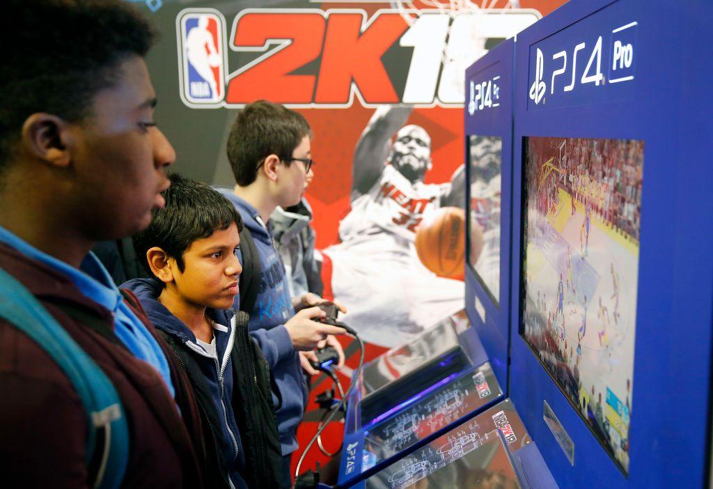 Children playing 2K games on PlayStation.