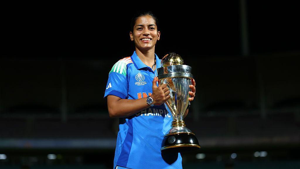 Amanjot Kaur of India poses with the ICC Women's Cricket World Cup trophy after the ICC Women's Cricket World Cup India 2025 Final match between India and South Africa at Dr. DY Patil Sports Academy on November 02, 2025 in Navi Mumbai, India. (Photo by Alex Davidson-ICC/ICC via Getty Images)