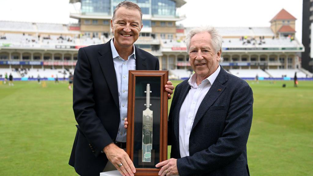 Rod Bransgrove (right) being presented with a silver bat by ECB chair Richard Thompson