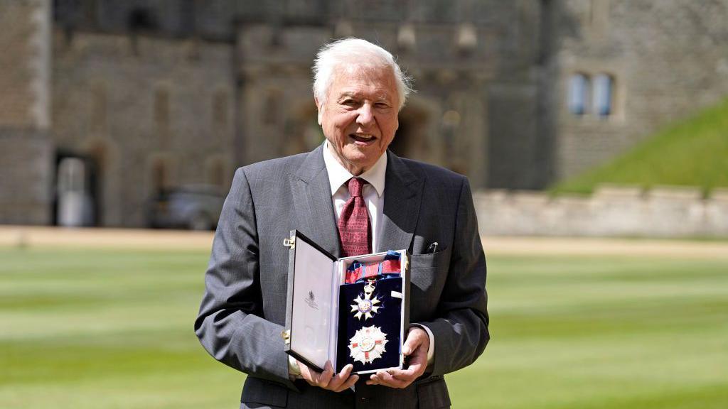Sir David being appointed a Knight Grand Cross of the Order of St Michael And St George.