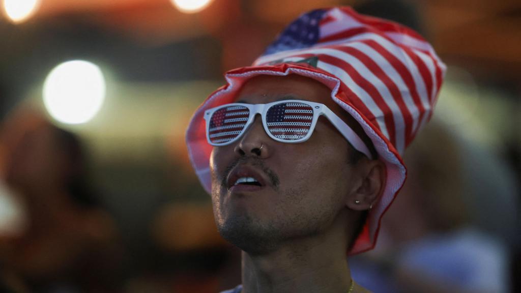 A man looks on as he watches Macy's Fourth of July fireworks