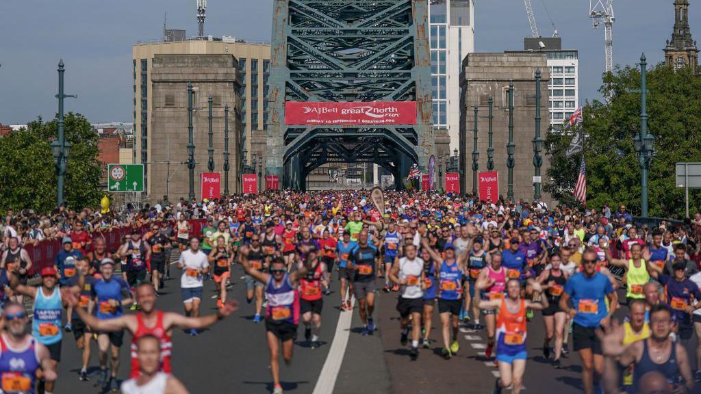 Runners cross the Tyne Bridge as they take part in the AJ Bell Great North Run on September 10, 2023