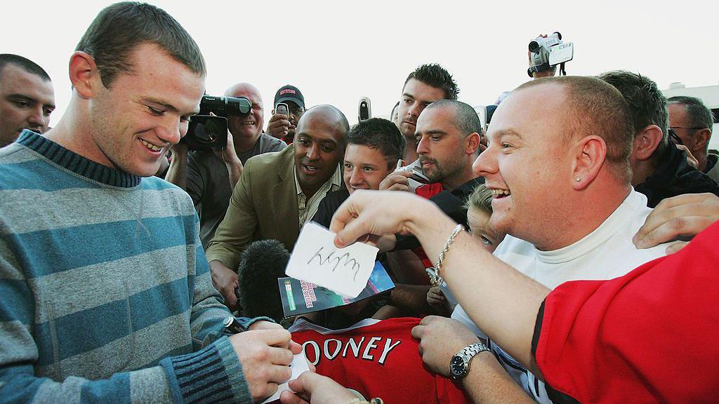 Wayne Rooney meets fans as he signs for Manchester United in 2004