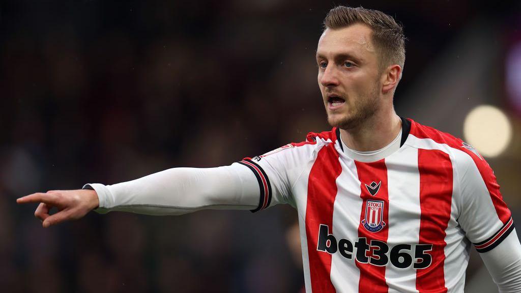 Ben Wilmot points some instructions to team-mates during a Stoke City match.