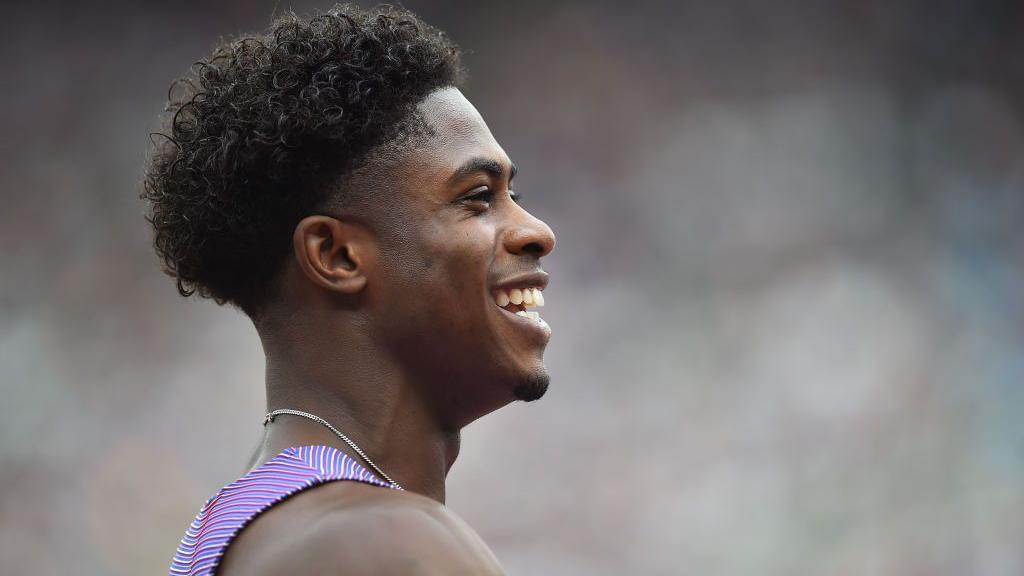 Jeremiah Azu smiles at the end of a race