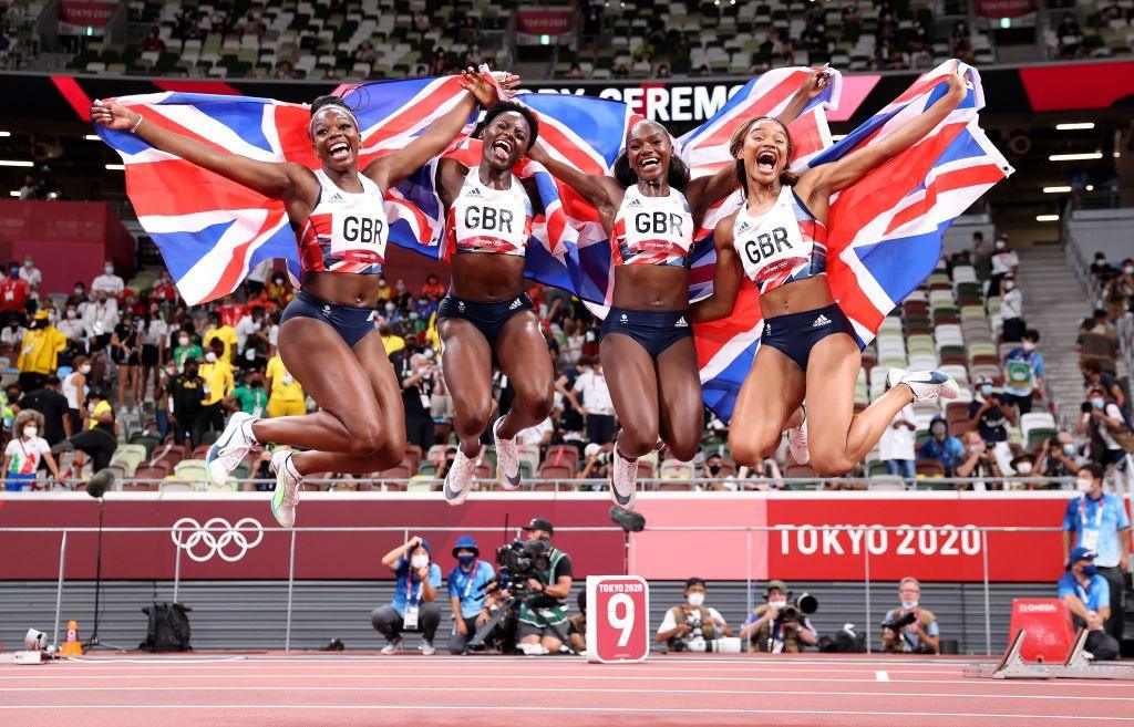 Asha Philip, Imani Lansiquot, Dina Asher-Smith and Daryll Neita of Team Great Britain celebrate winning bronze at Tokyo 2020