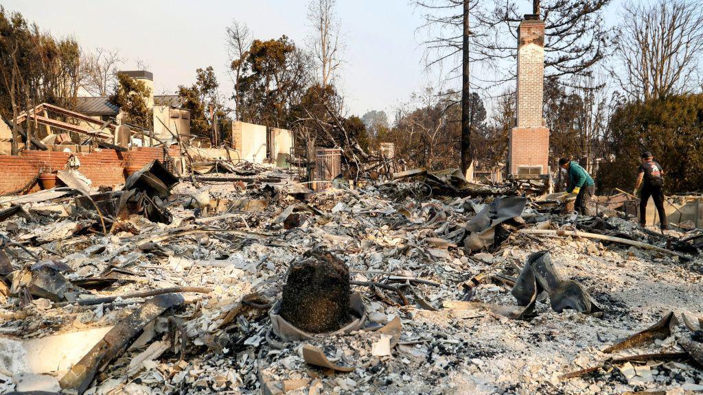 Anthony Hopkins' destroyed home the entire house is gone with deep piles of ash and blackened rubble. Only the brick chimney and a brick wall are still standing