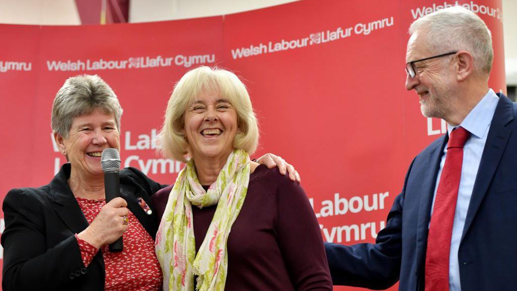 Jane Hutt (L) looks-on as Jeremy Corbyn congratulates Ruth Jones, the new MP for Newport West on April 05, 2019