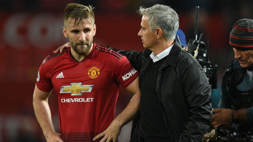 Jose Mourinho putting his arm around Luke Shaw's shoulder