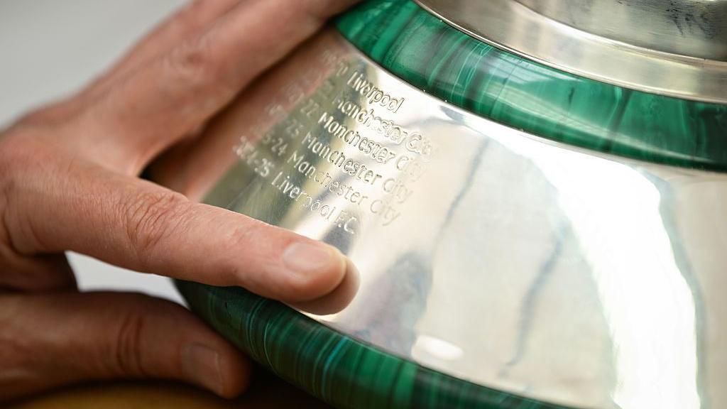 Liverpool's name has been etched on the Premier League trophy (for some reason in a different format to 2019-20)