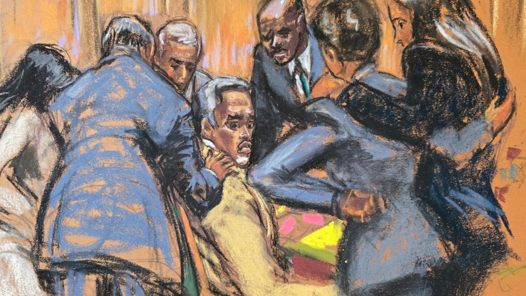A court sketch showing defence lawyers comfort Sean "Diddy" Combs 