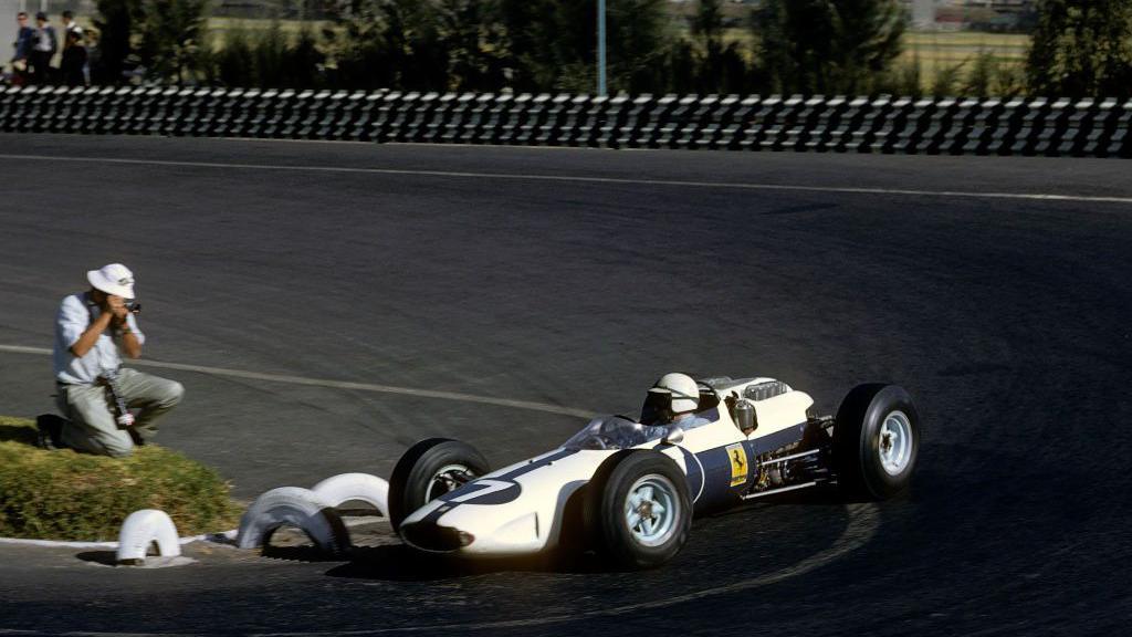 John Surtees steers his Ferrari around a corner during the 1964 Mexican Grand Prix