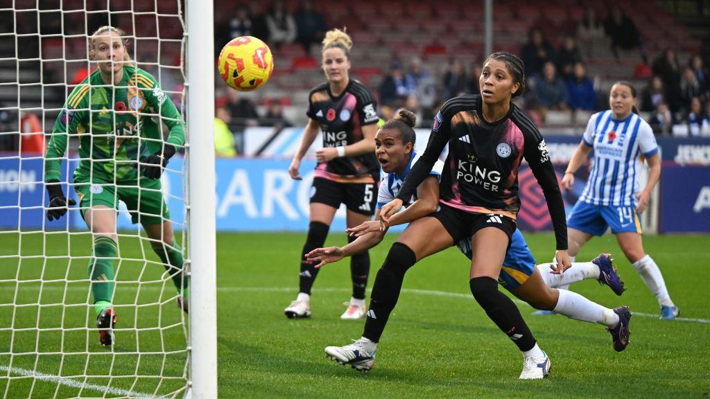 Nikita Parris scores a diving header for Brighton