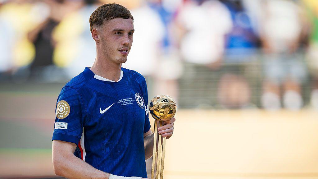 Cole Palmer of Chelsea FC poses with 'Golden Ball' award during the award ceremony following the FIFA Club World Cup final