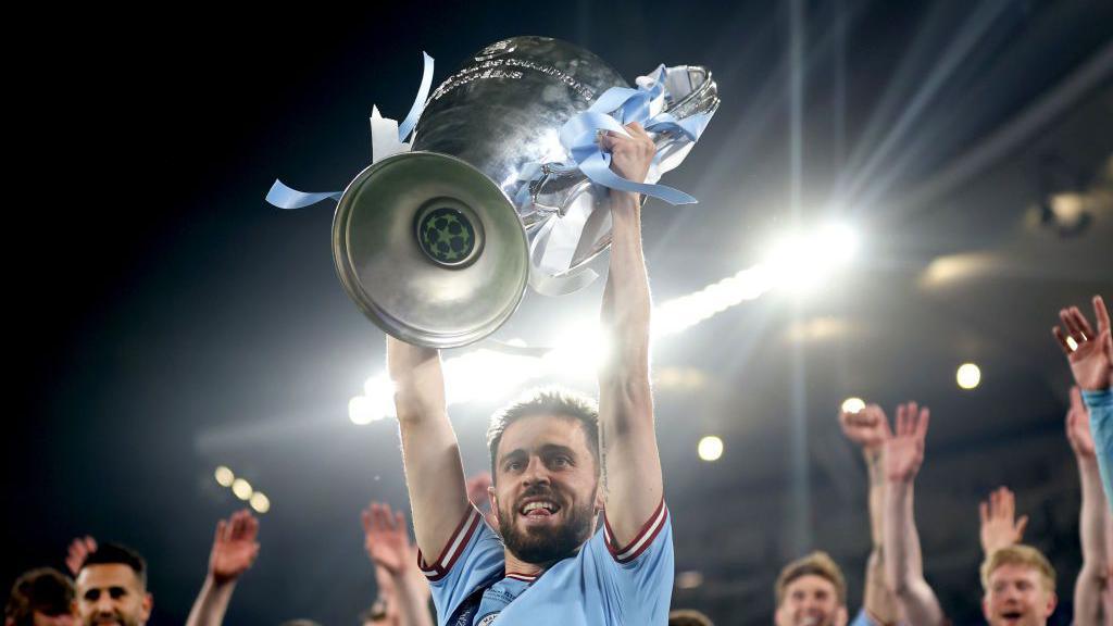 Bernardo Silva lifting the Champions League