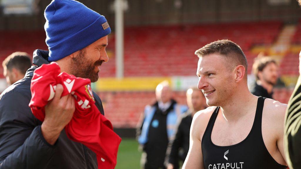 Wrexham co-owner Ryan Reynolds (L) with striker Paul Mullin in 2023
