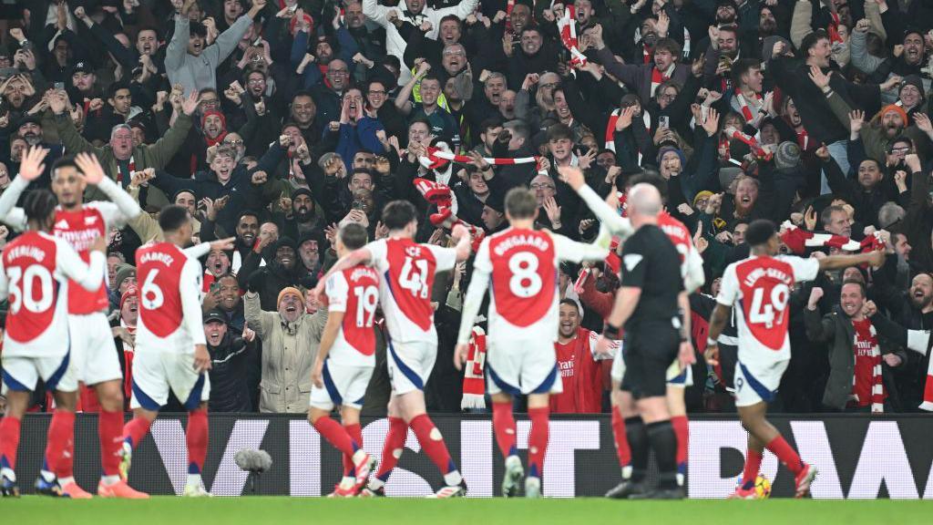 Arsenal players celebrate at Emirates Stadium