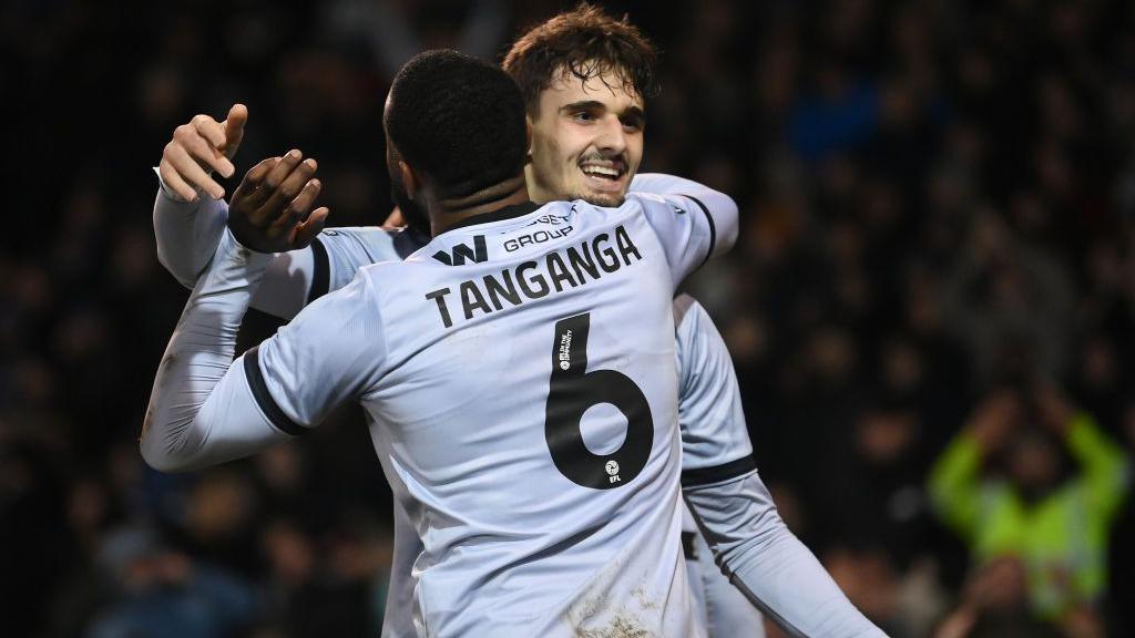 Mihailo Ivanovic (right) celebrates with Japhet Tanganga (left) after scoring for Millwall